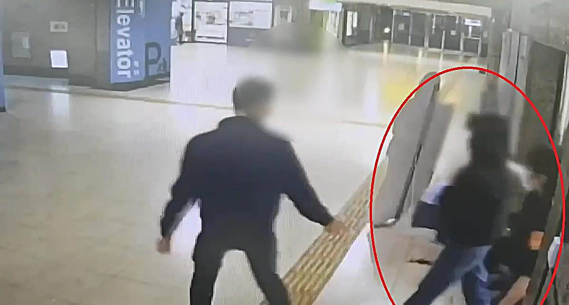 Cassandra Low (in red circle) seen at a train station in Taiwan, where she attempted to force singer Olivia Tsao into reconnecting with her on social media.