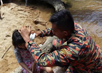 Girl,7, kept trying to rouse dad who died in 20m fall