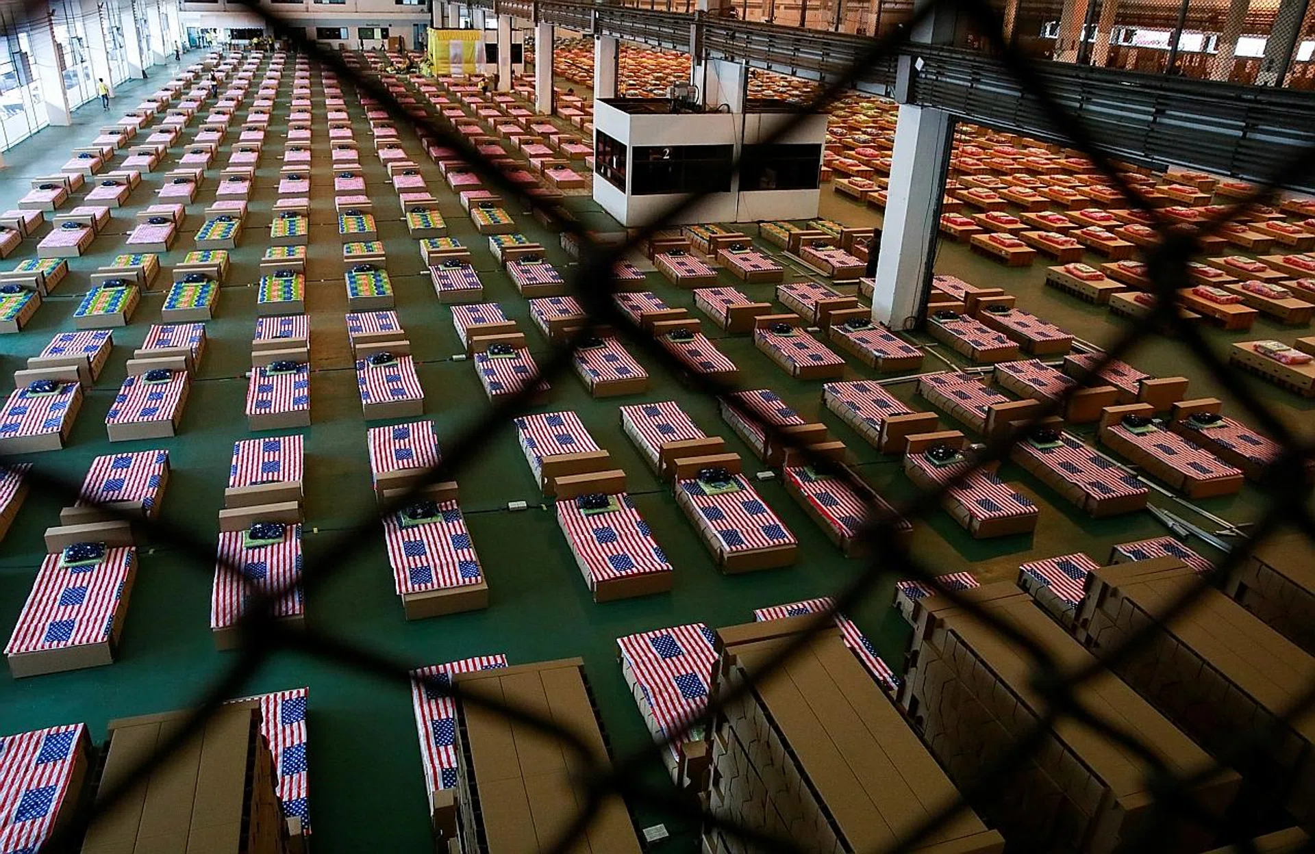 Beds in an air cargo warehouse that has been converted into a Covid-19 field hospital in Bangkok, Thailand.