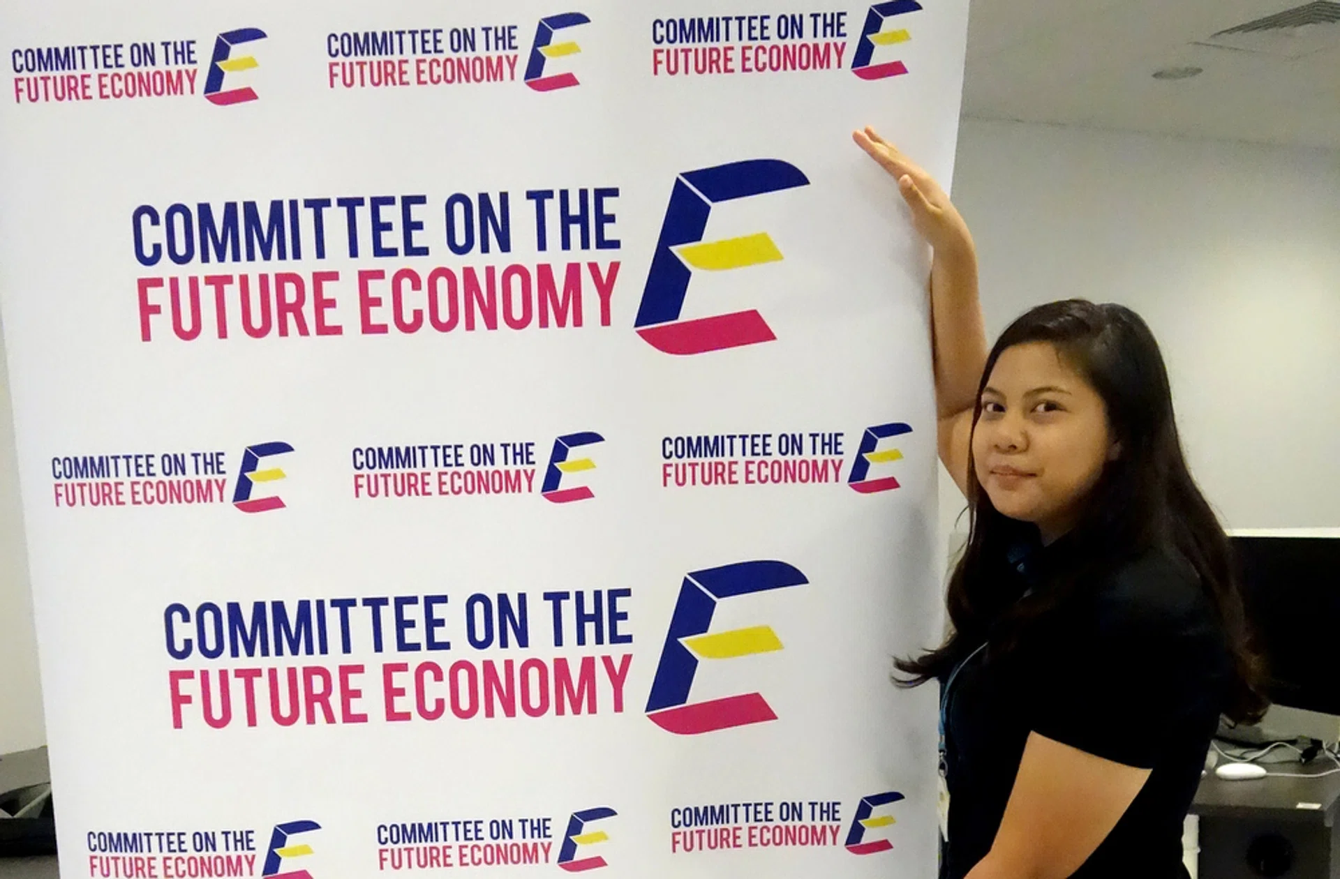 EYE-CATCHING: Miss Nur Hazirah Su'Aidi with her winning logo, which is designed to look like a staircase.