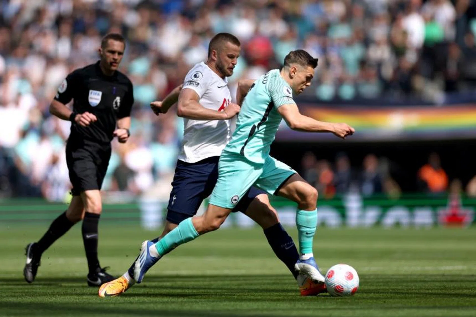 Tottenham's Eric Dier in action with Brighton's Leandro Trossard (right) at the Tottenham Hotspur Stadium in London on April 16, 2022. 