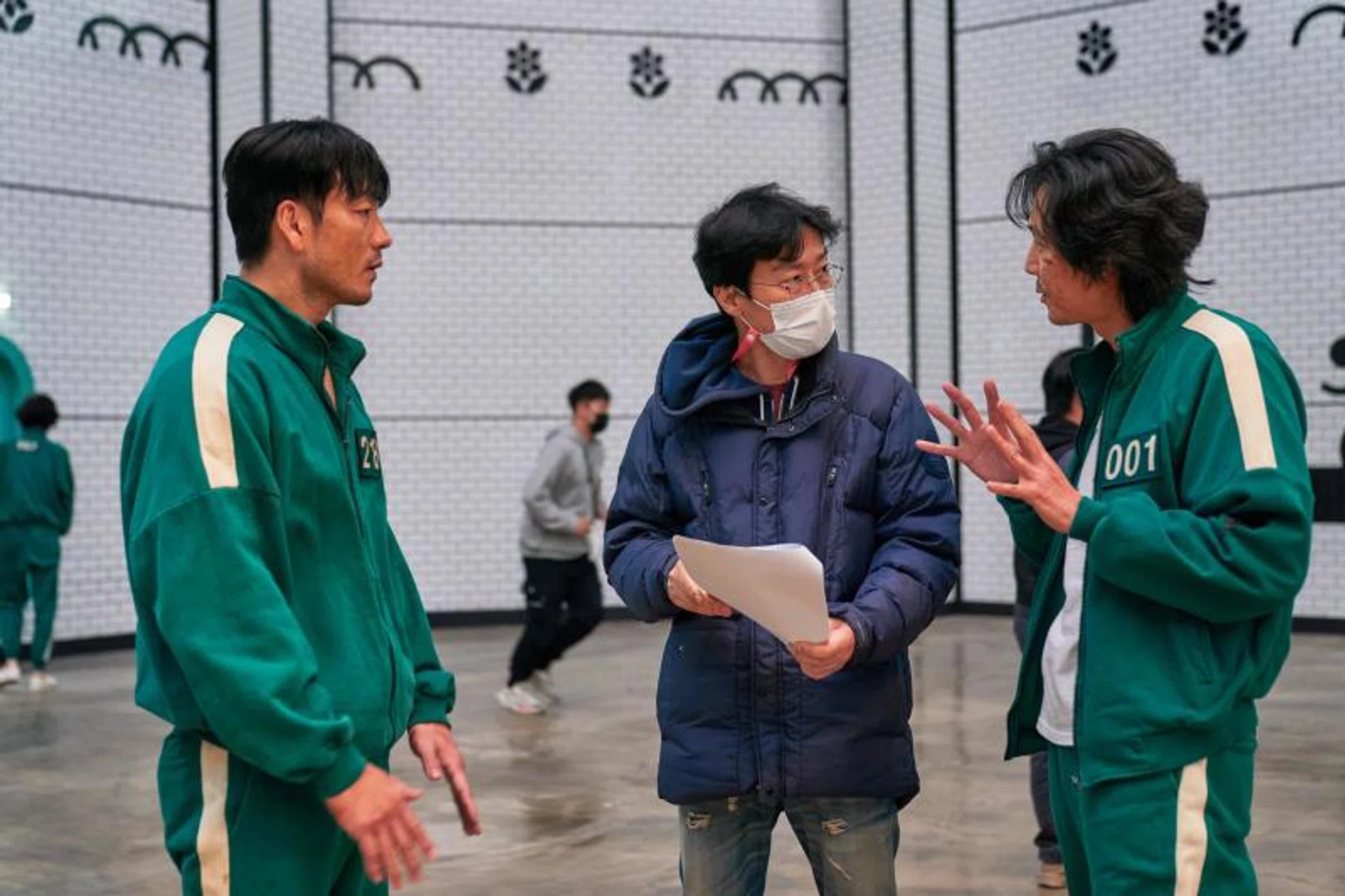 Director Hwang Dong-hyuk (centre) has seemingly relented on making a second season of the massively successful Netflix K-drama.