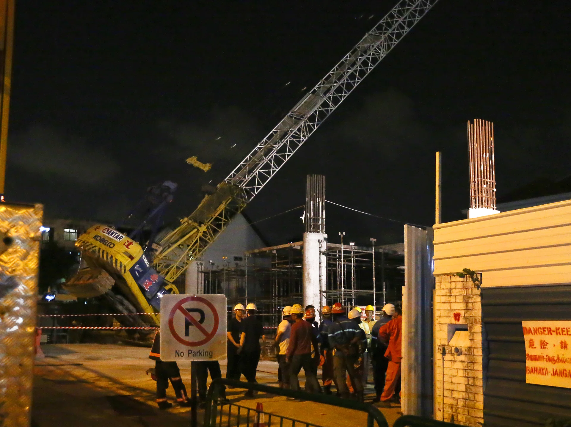 COMPLEX OPERATION: As of 11.45pm yesterday, work to put the crane upright was still ongoing.