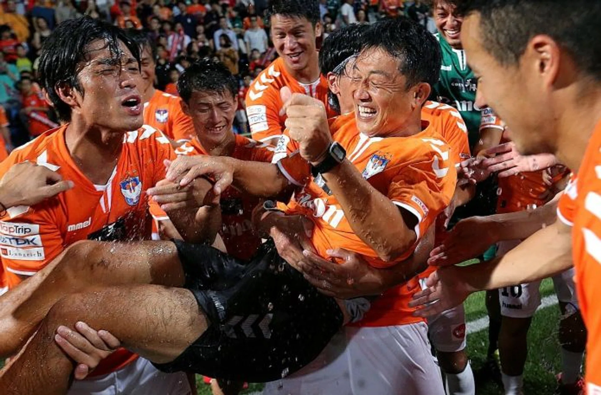 MILESTONE: Albirex's outgoing coach, Naoki Naruo (centre), is the first coach to win all four titles on offer in the same year.