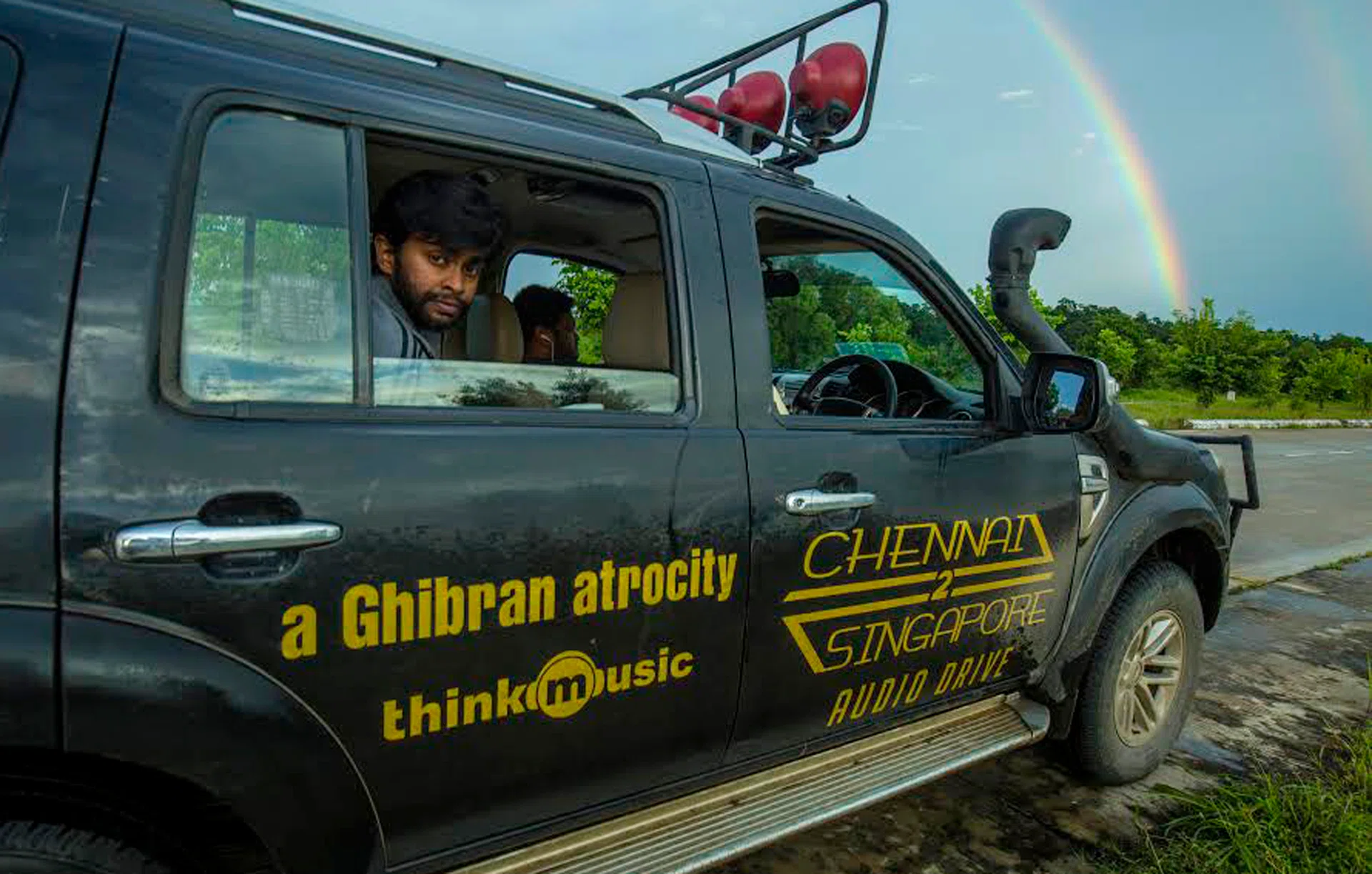 ON THE ROAD: Director Abbas Akbar in the Ford Endeavor SUV used in his road trip from Chennai to Singapore. 