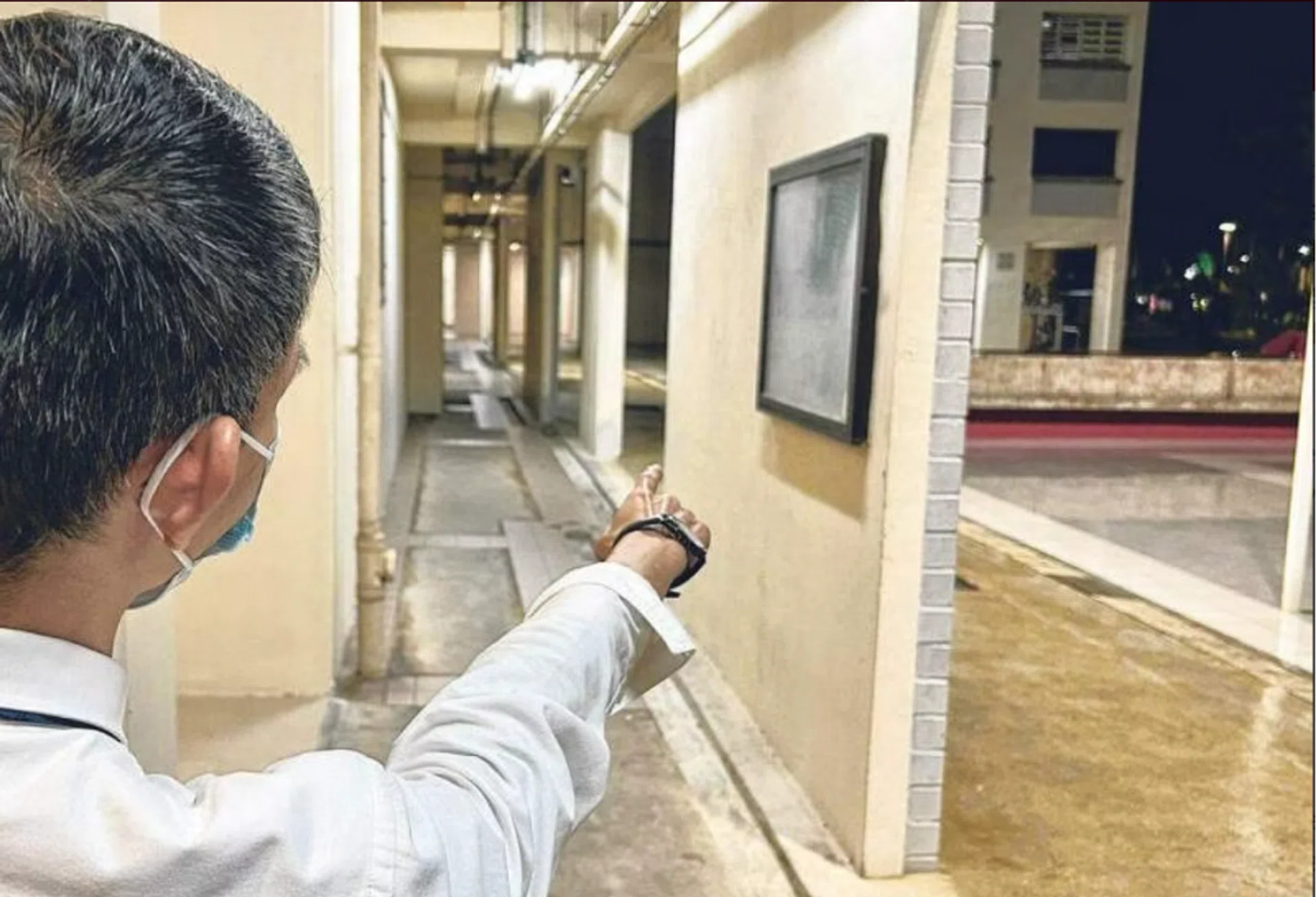 The resident showing the spot where he encountered the women.