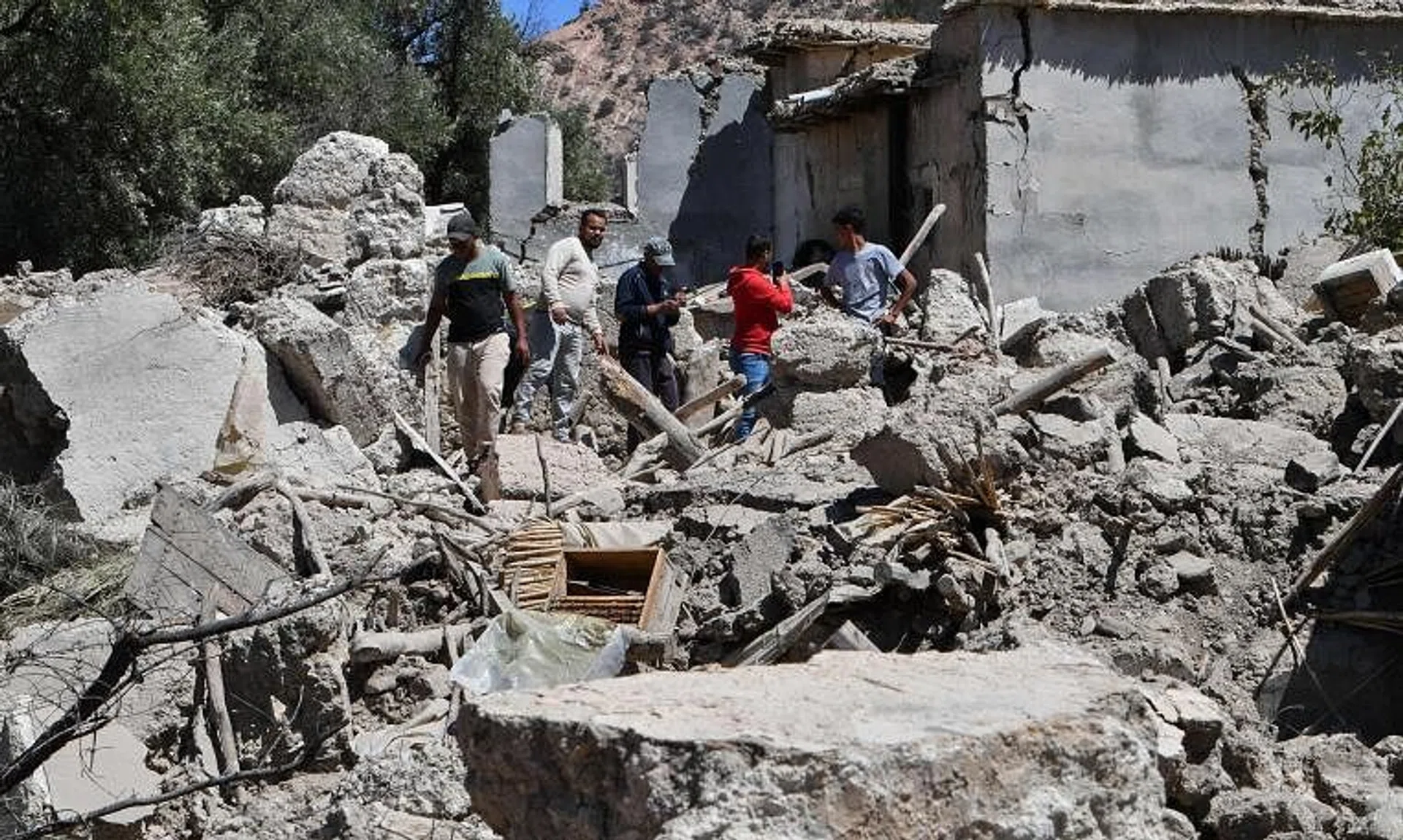 Residents searching through the rubble of their homes in Imoulas village, Morocco, on Sept 11.