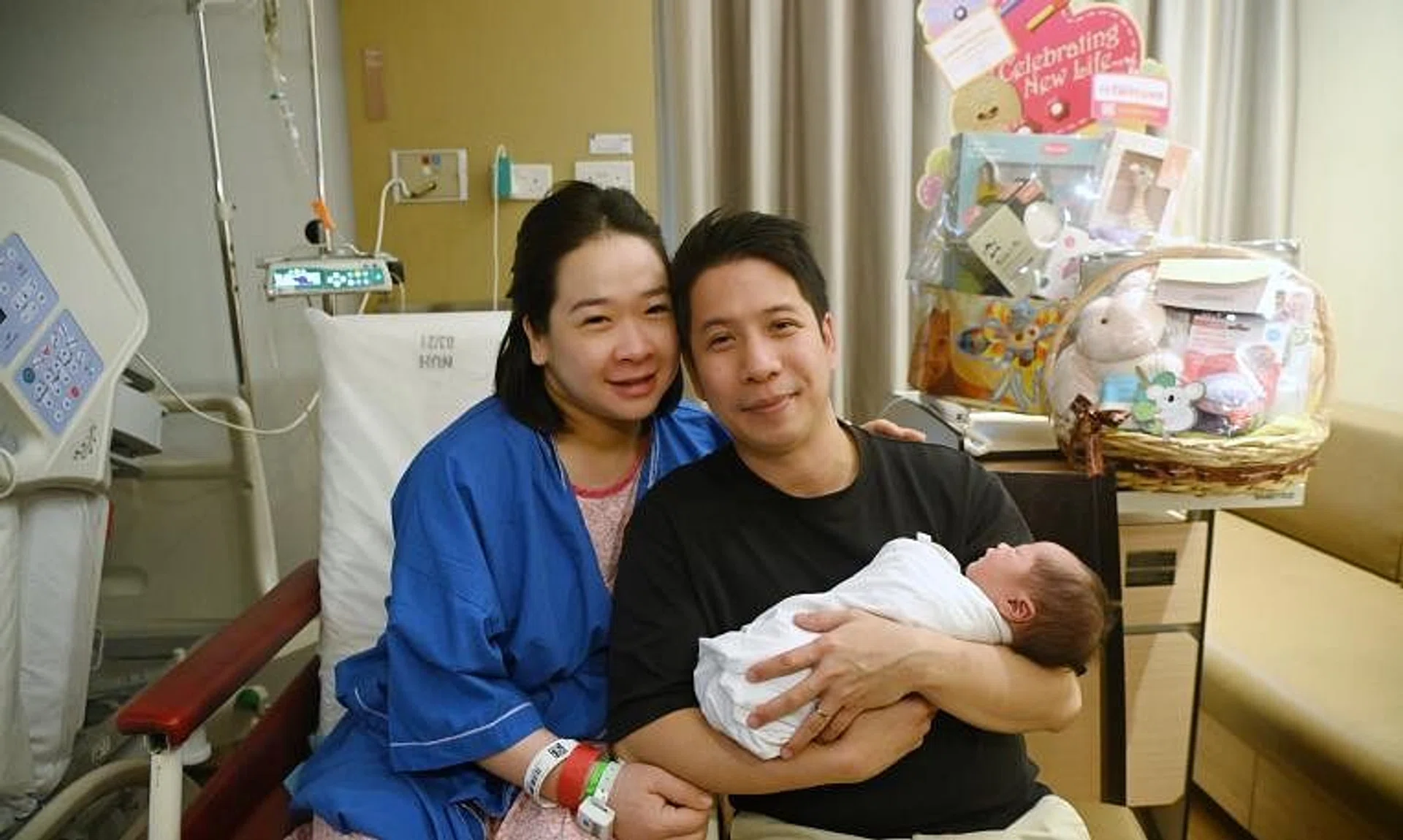 Madam Lam Nguyet Minh and Mr Noel Ng with their son Denzel, who was born at 12.02am on Jan 1.
