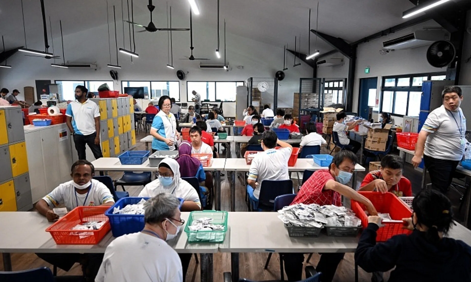 Clients at an activity workspace called Oaktree, which supports ageing clients who are 45 and above, at Minds Regional Hub (Hougang).