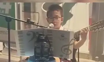 China boy caught vandalising made to busk for restitution