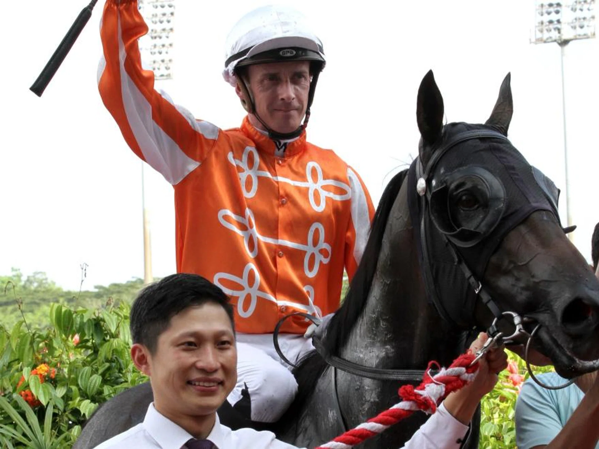 Australian jockey Daniel Moor raising his whip to celebrate his 71st Kranji win aboard the Jason Ong-trained Pacific Master on Sept 7. It was to be his last Singapore win.
