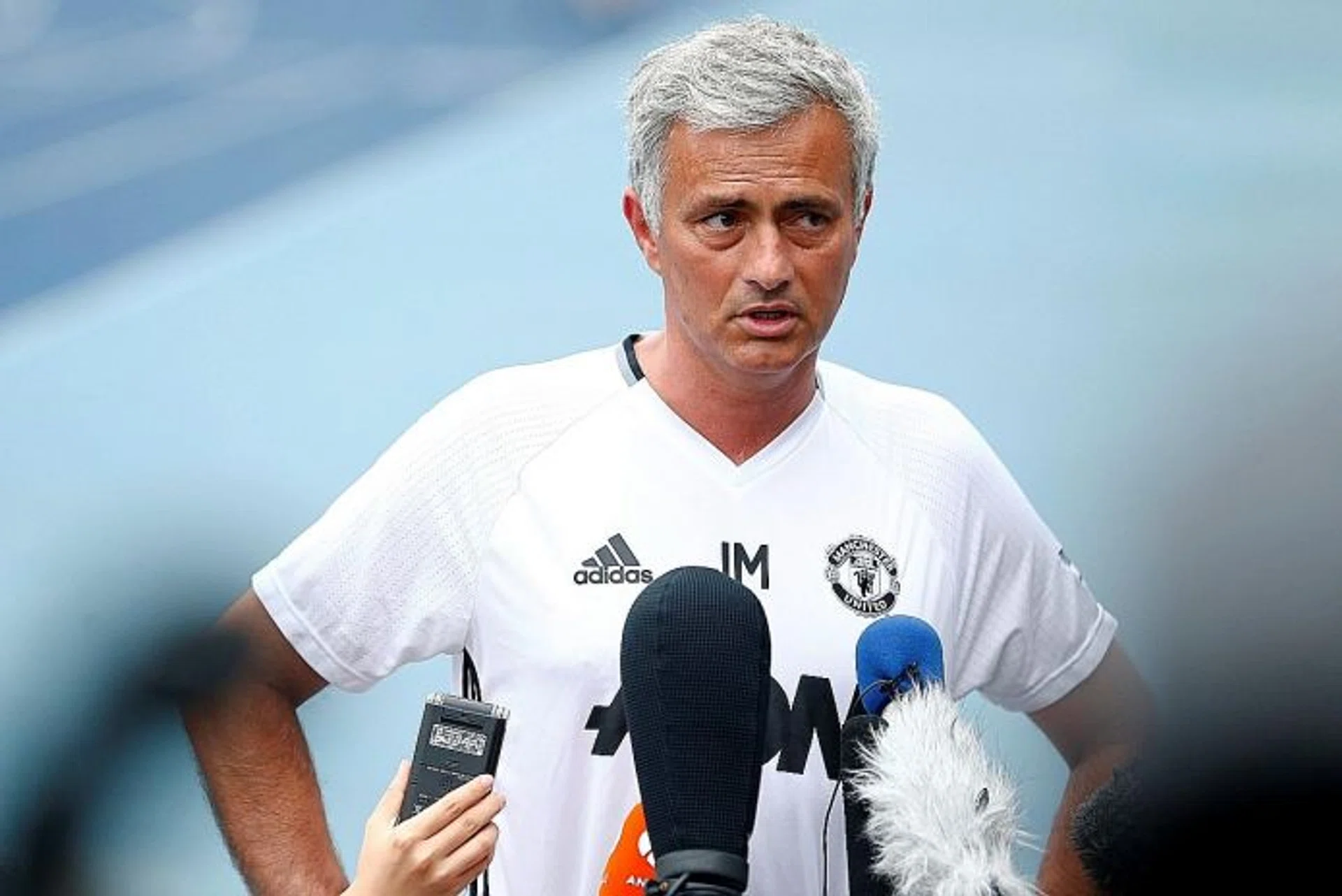 IMPROMPTU: Man United manager Jose Mourinho holding a hastily arranged press conference near the running tracks of the Olympic Sports Centre, as the press room was overcrowded  and too hot.