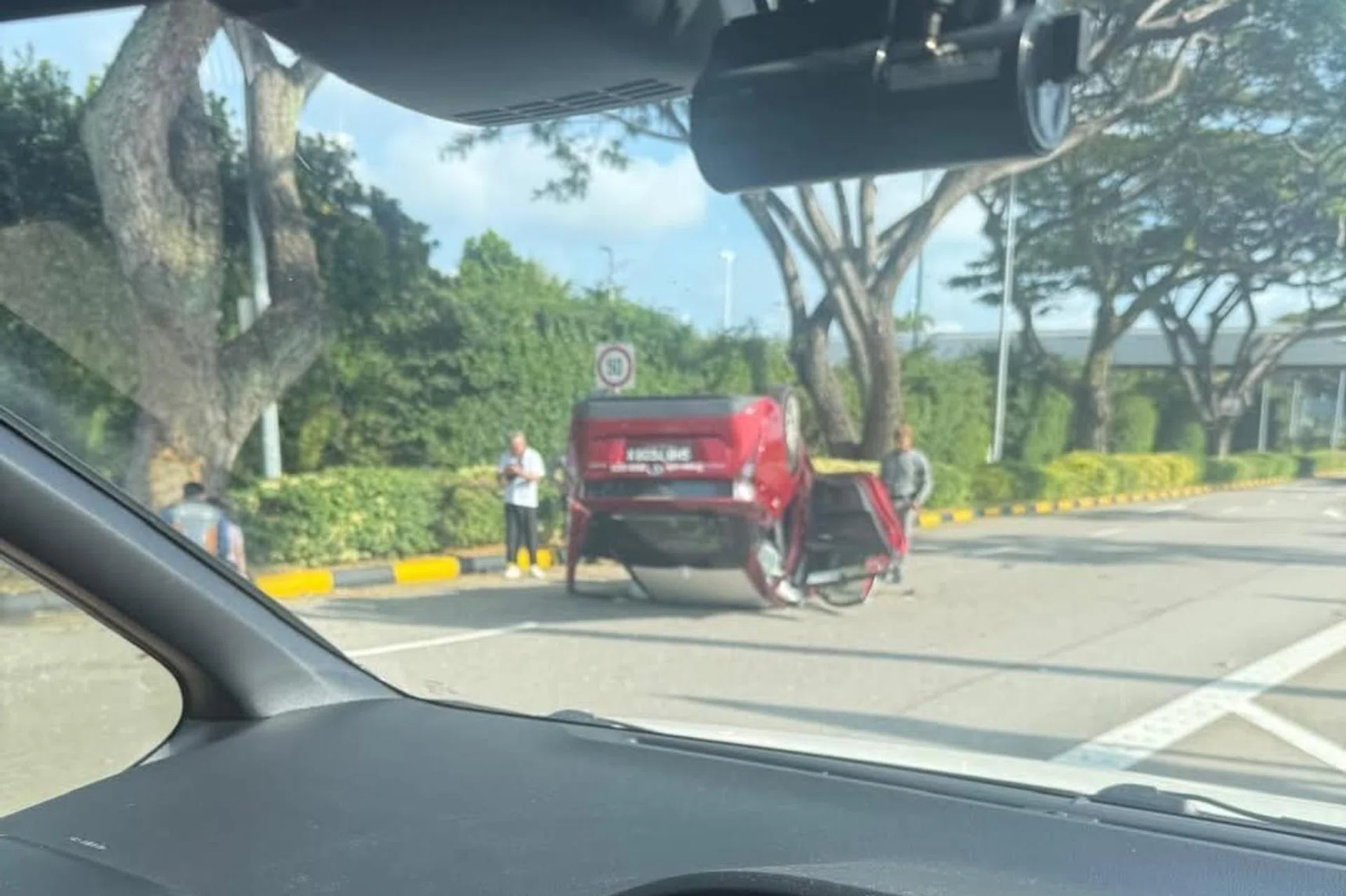 A Facebook user posted a photo of the accident on the SG Taxi Drivers group, showing the Trans-Cab taxi lying on its roof.