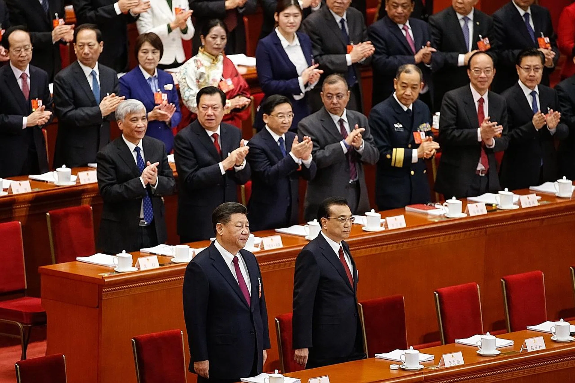Chinese President Xi Jinping (left) and Chinese Premier Li Keqiang at the opening of the first plenary session of the 13th National People's Congress at the Great Hall of the People in Beijing yesterday. 