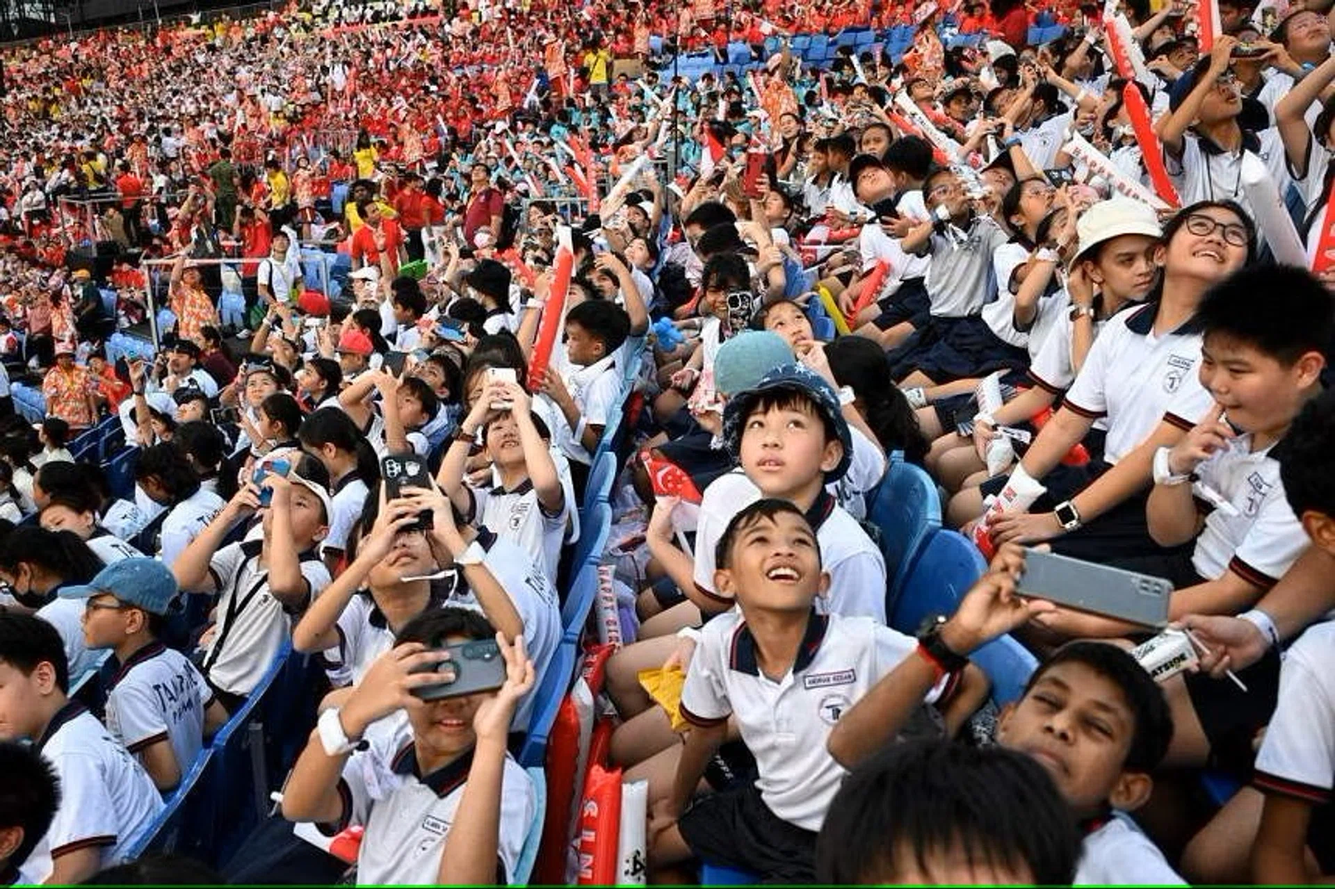 Pupils watching an aerial display during the National Day Parade National Education show on June 29. 