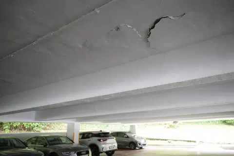 Spalling concrete and water seepage can be seen in the car park of Lakeview Estate.