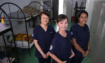Nurses visit migrant workers' dorms to care for the sick