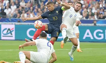 Record Mbappe leads France to another Euro qualifier win against 10-man Greece