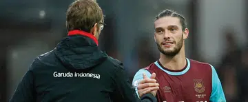 Carroll strikes back to sink Liverpool