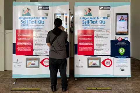 Australia politician shares Singapore's ART vending machine to chide his own govt