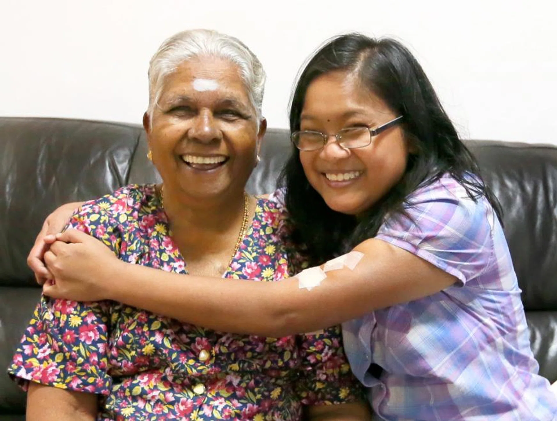 (From left) Madam Ledly Udayappan took in Miss Nadia when she was five months old.
