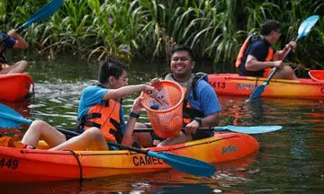 Dragon boaters and S'pore Children's Society beneficiaries team up to clean Lower Seletar Reservoir