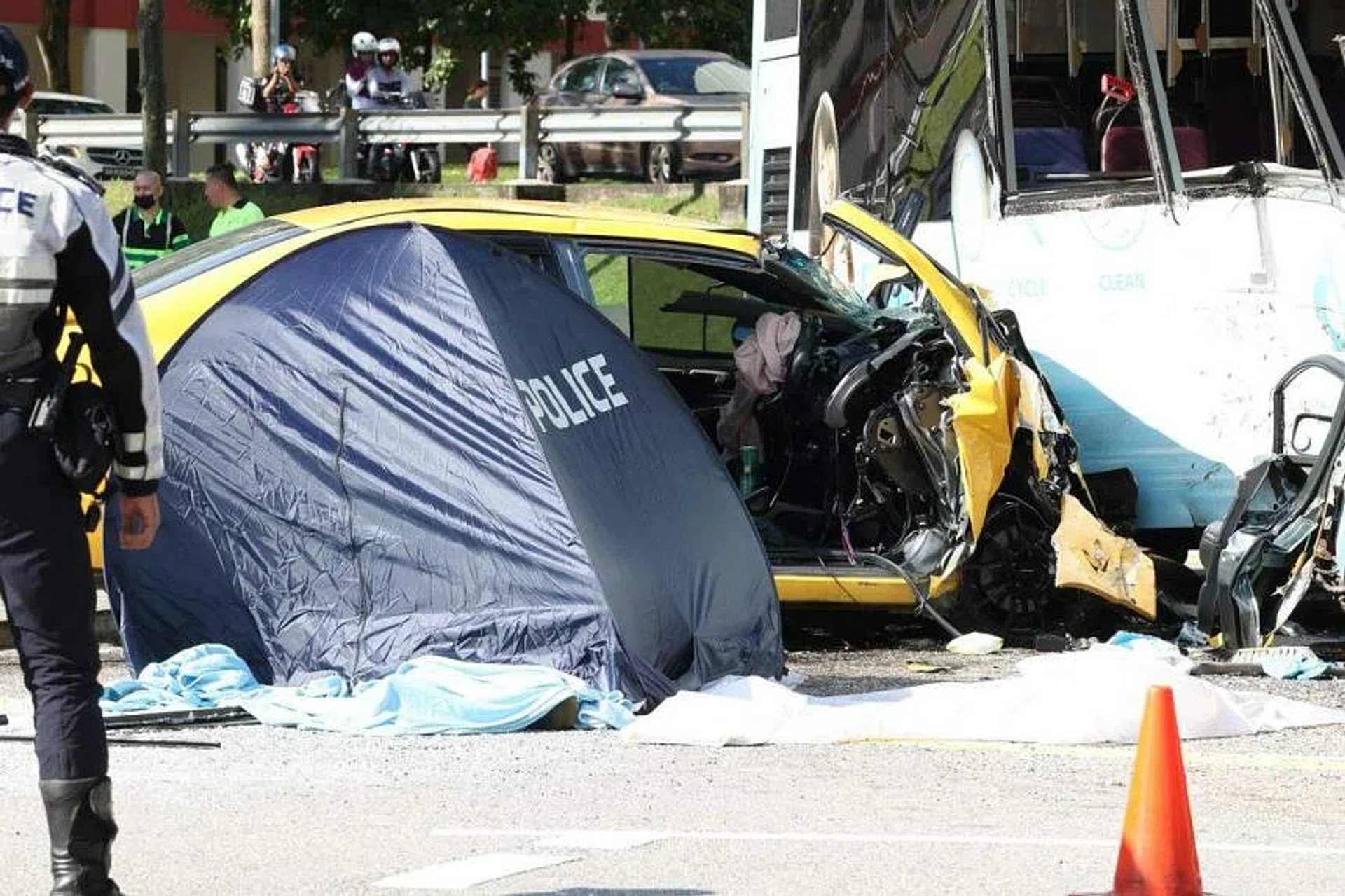 Mr Muhammad Hadi Sazali's car was seen speeding before it beat a red light and crashed into Tower Transit bus service 858 in Woodlands. PHOTO: LIANHE ZAOBAO
