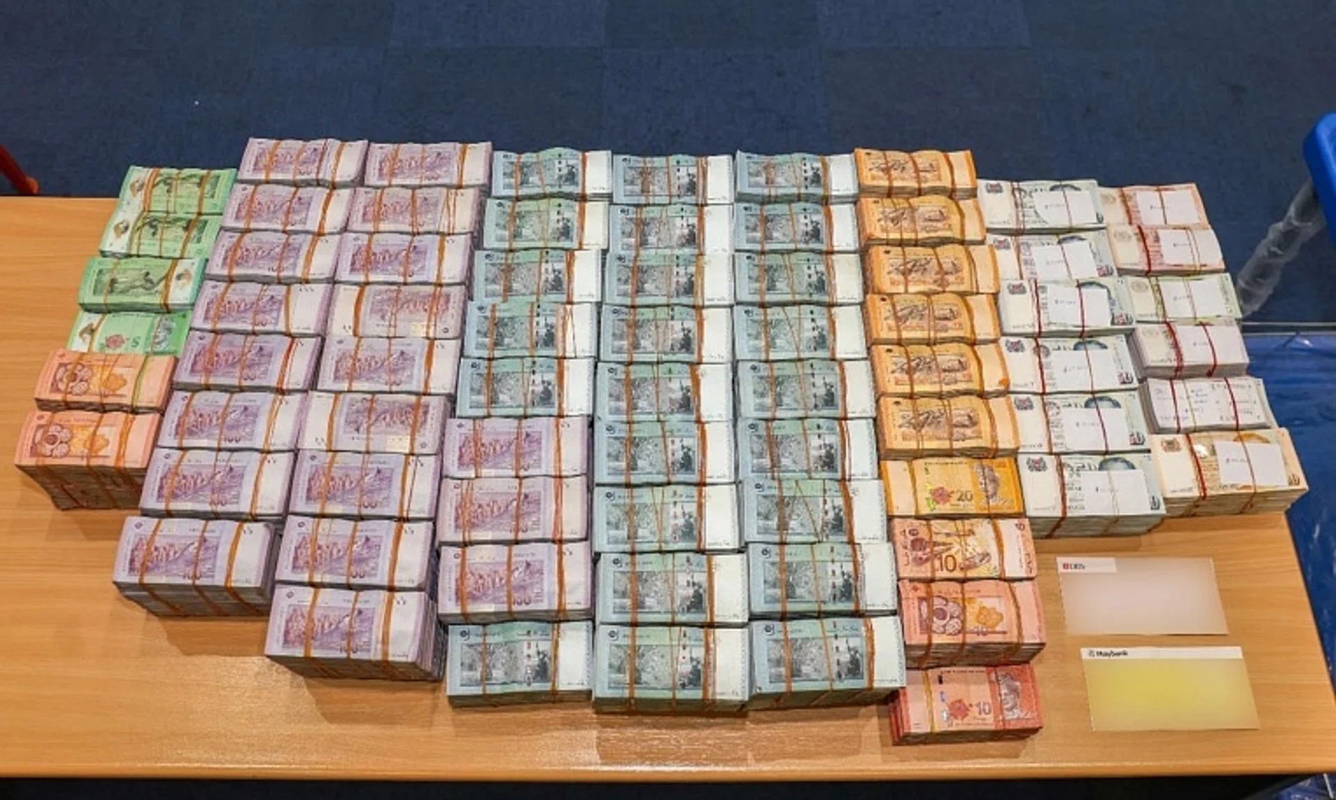 The man was among eight travellers caught trying to move large amounts of cash in Singapore without declaration.