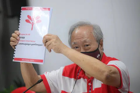 PSP chairman Tan Cheng Bock presenting the party's manifesto and campaign slogan at the PSP headquarters on April 6.