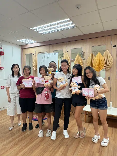 Build your own bear: PAP's Sengkang East branch chairwoman Bernadette Giam with residents.