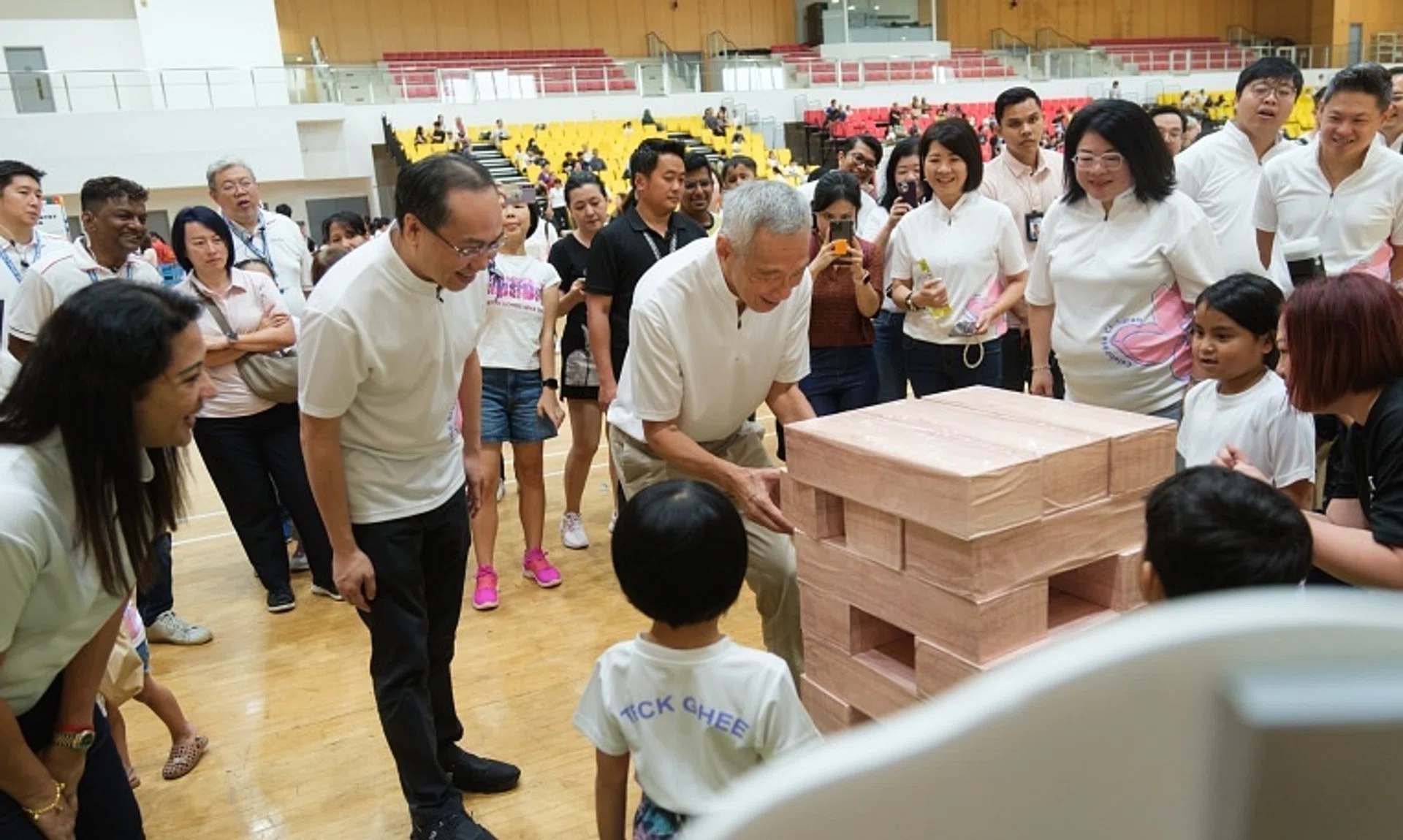 Senior Minister Lee Hsien Loong (centre) interacting with young children at the launch of the Teck Ghee Preschool Network on Sept 29.