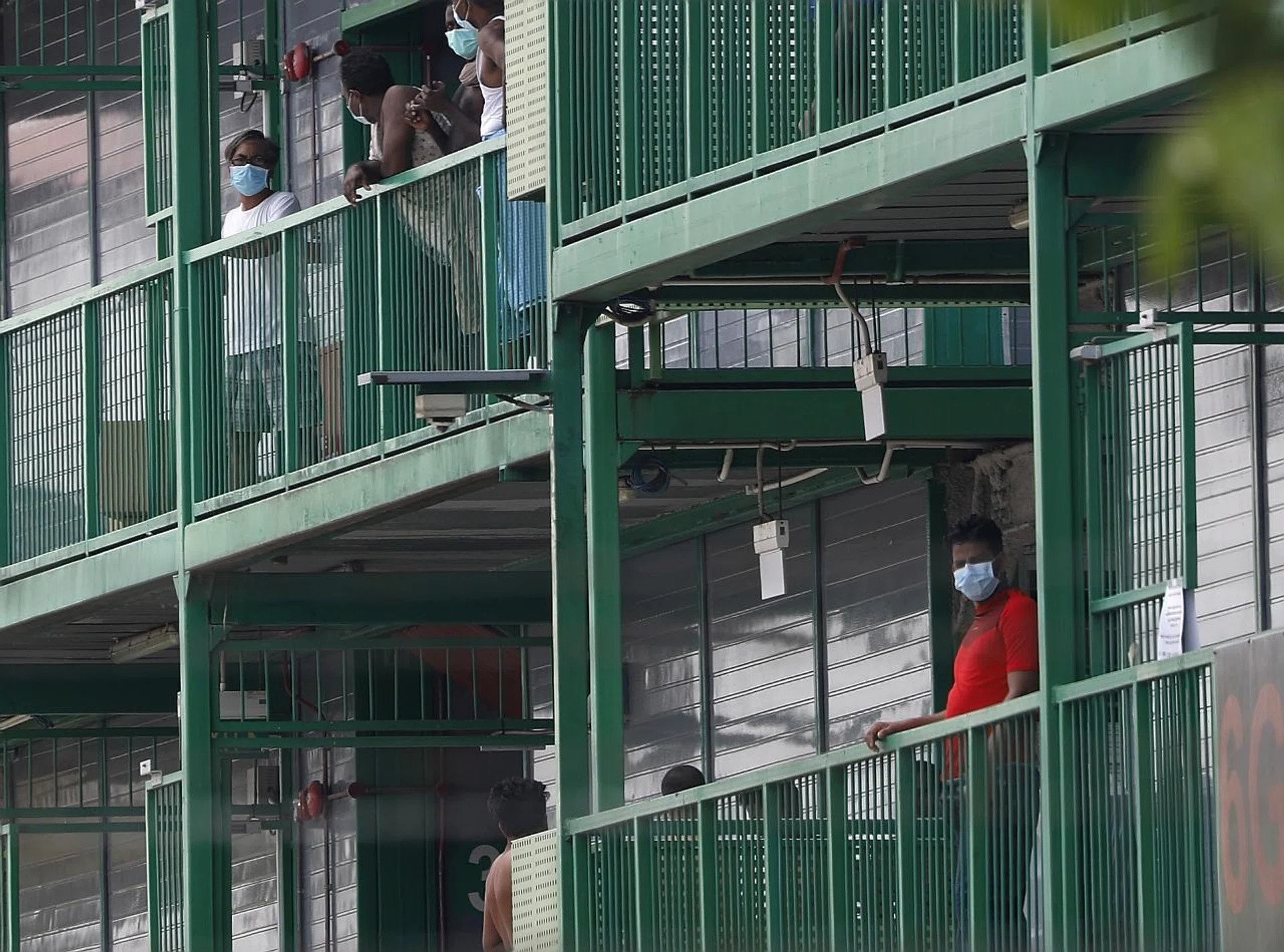 Migrant workers at the S11 Punggol dormitories, a declared isolation area. 