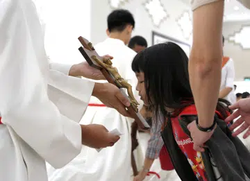 Churchgoers observe Good Friday with outdoor procession