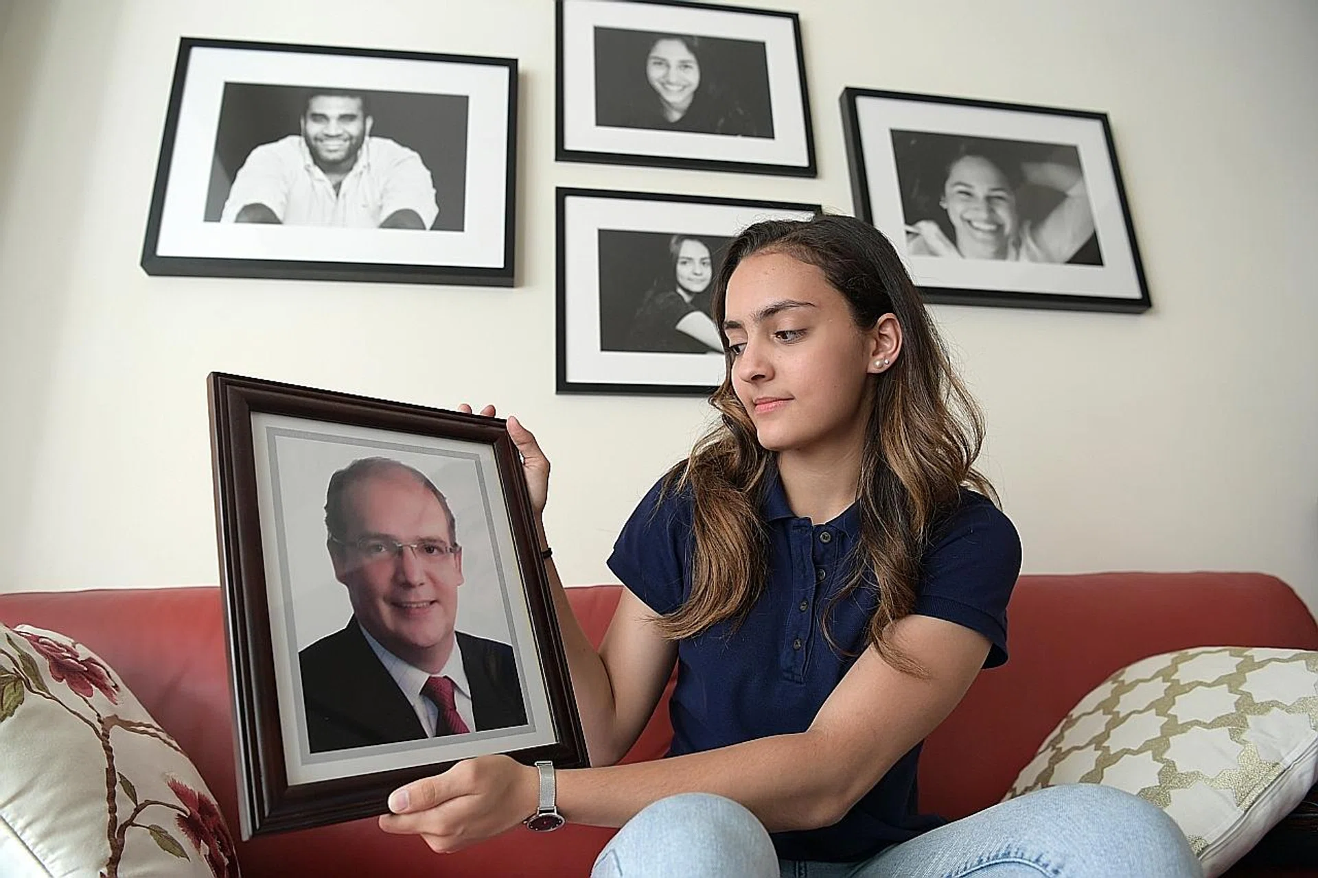 National fencer Amita Berthier with a photo of her late father Eric. 