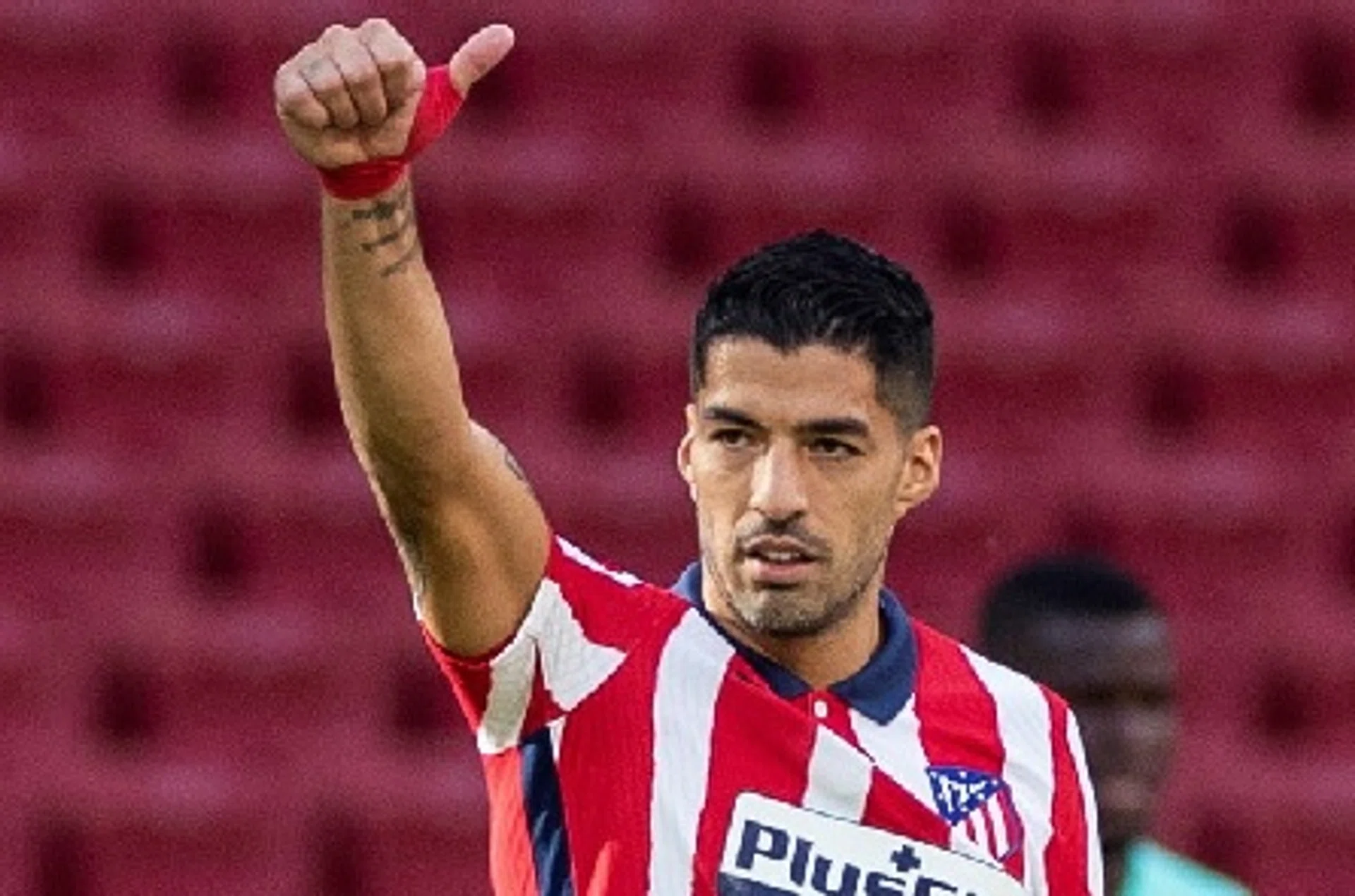 Striker Luis Suarez, who moved to Atletico Madrid from Barcelona only on Friday, started on the bench against Granada on Sunday.