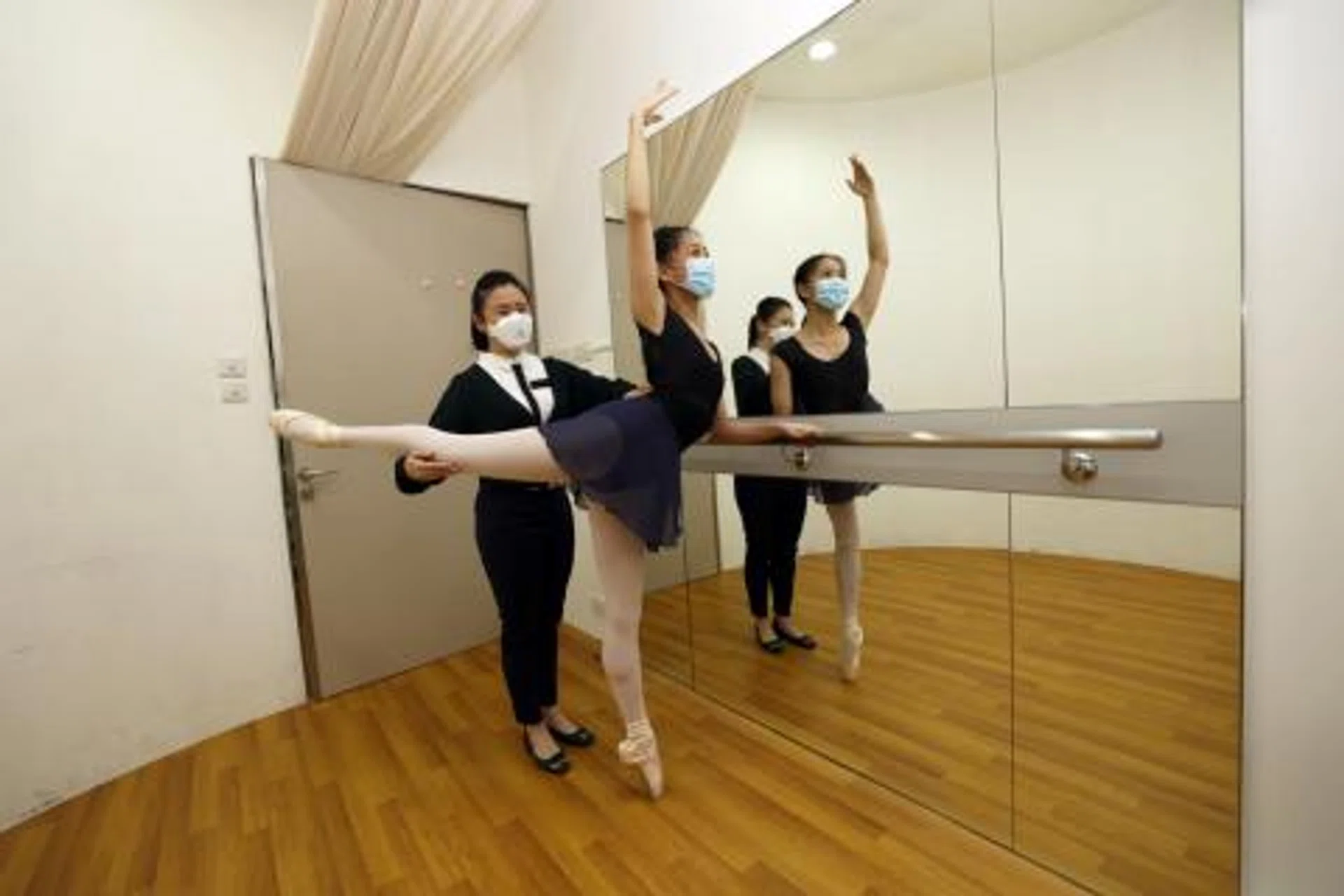 Dr Mandy Zhang (left), a consultant at Changi General Hospital's department of sport and exercise medicine, with dance graduate Lam Kar Yi.