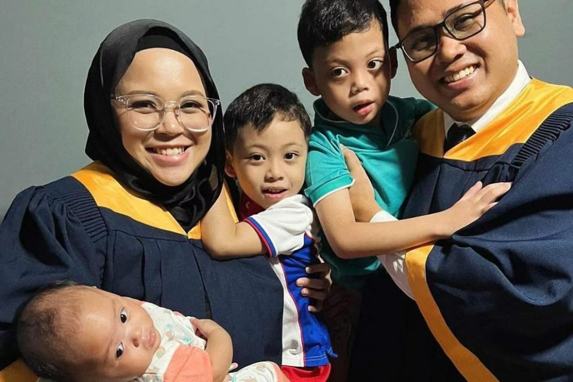 Ms Zoey Zuaswina Zupri and her husband, Mr Nur Muhammad Ifwat and their three children: Khairie, Wafie and Qalbie.
