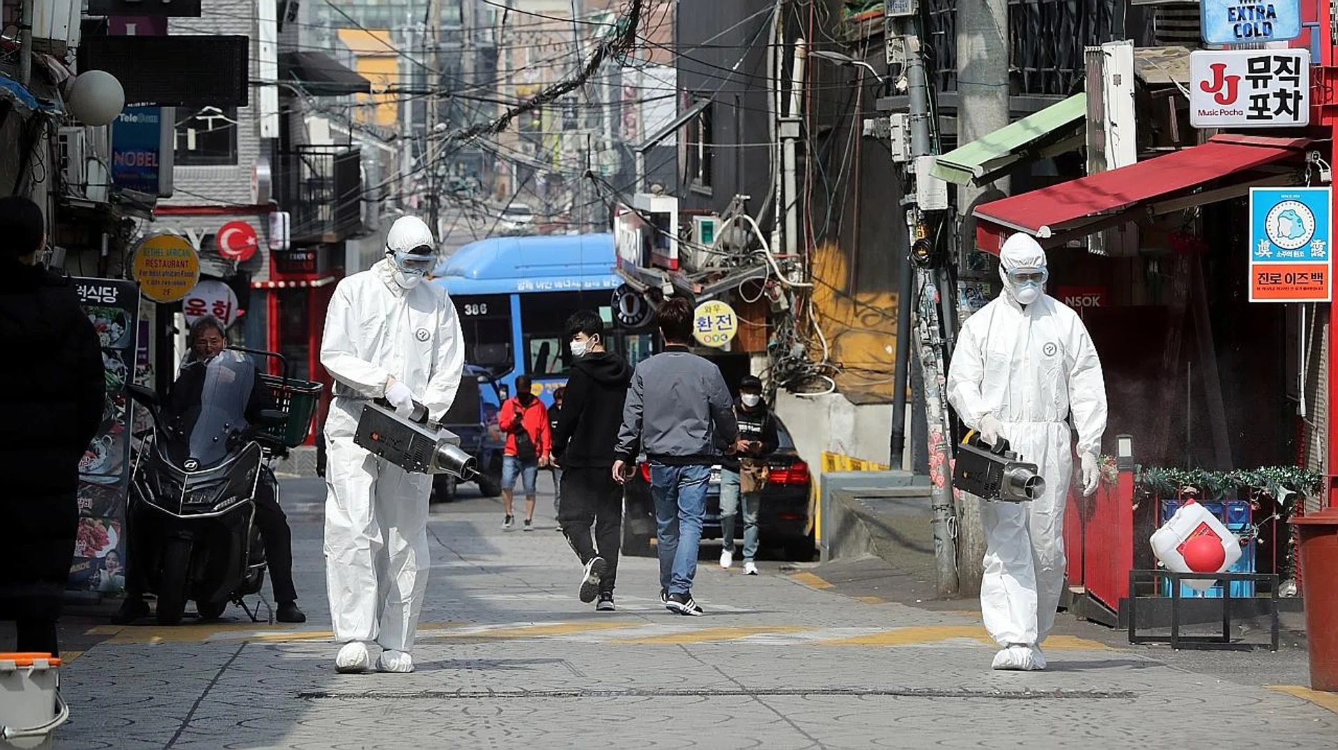 Quarantine workers spraying disinfectants at night spots in the Itaewon neighbourhood of Seoul, as South Korea grappled with a growing number of coronavirus infections there. 