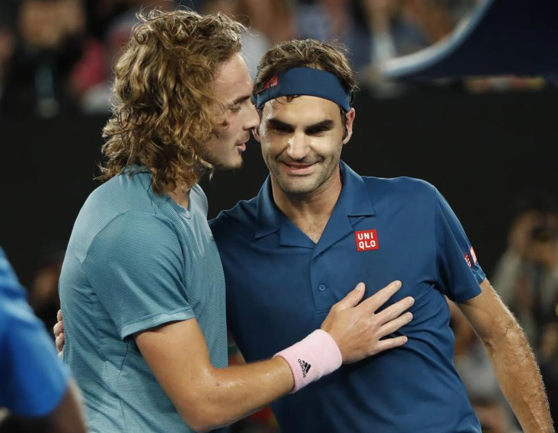 Roger Federer congratulating Stefanos Tsitsipas after the 20-year-old Greek defeated him to reach the quarter-finals of the Australian Open.