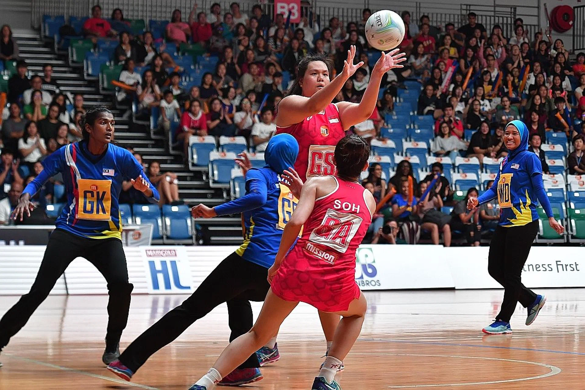 Lee Pei Shan (receiving ball) epitomises Singapore's much-improved display yesterday. 