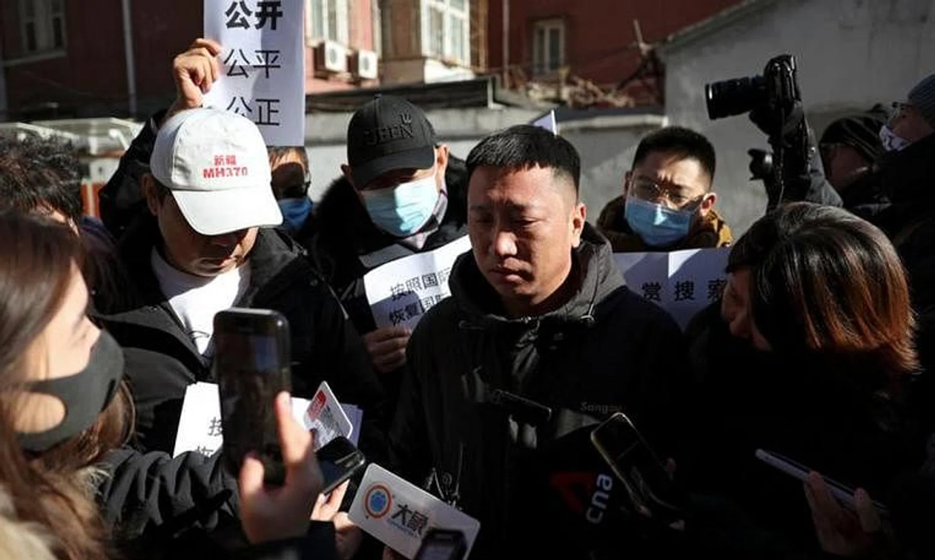 A man surnamed Fu, who lost his brother, reacts as he speaks to the media following a court hearing on compensation for those who lost their loved ones on the Malaysia Airlines flight MH370 that went missing in 2014, in Beijing, China November 27, 2023. REUTERS/Florence Lo