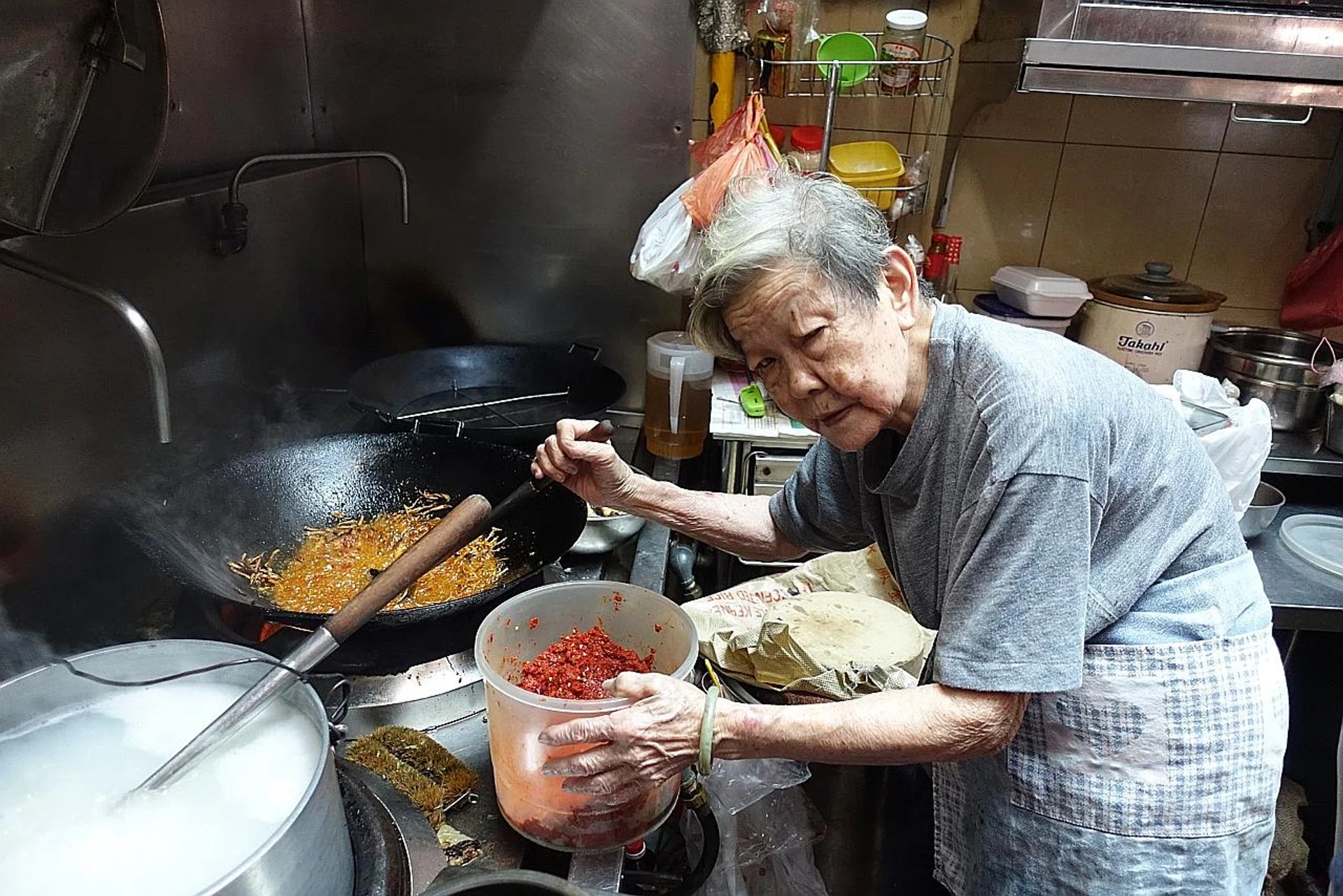 Madam Seah, 82, still single-handedly churns out the dishes at her Maxwell Food Centre stall. 