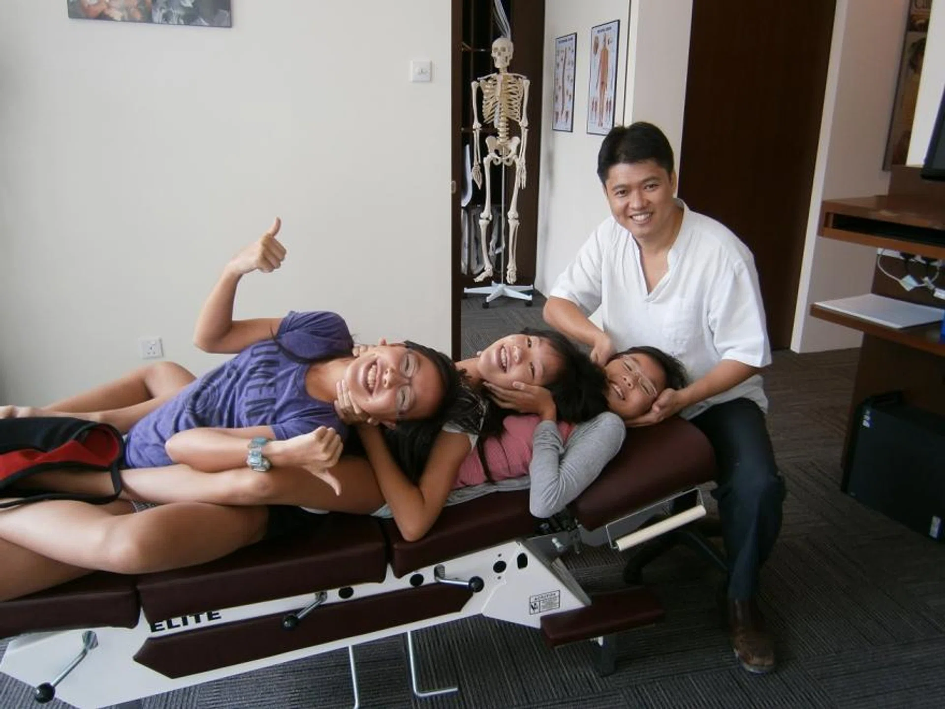 Dr Matt Kan,  senior  consultant and  chief executive  of Chiropractic  First, assures  clients that  chiropractic care  is extremely safe  for infants and  children. 