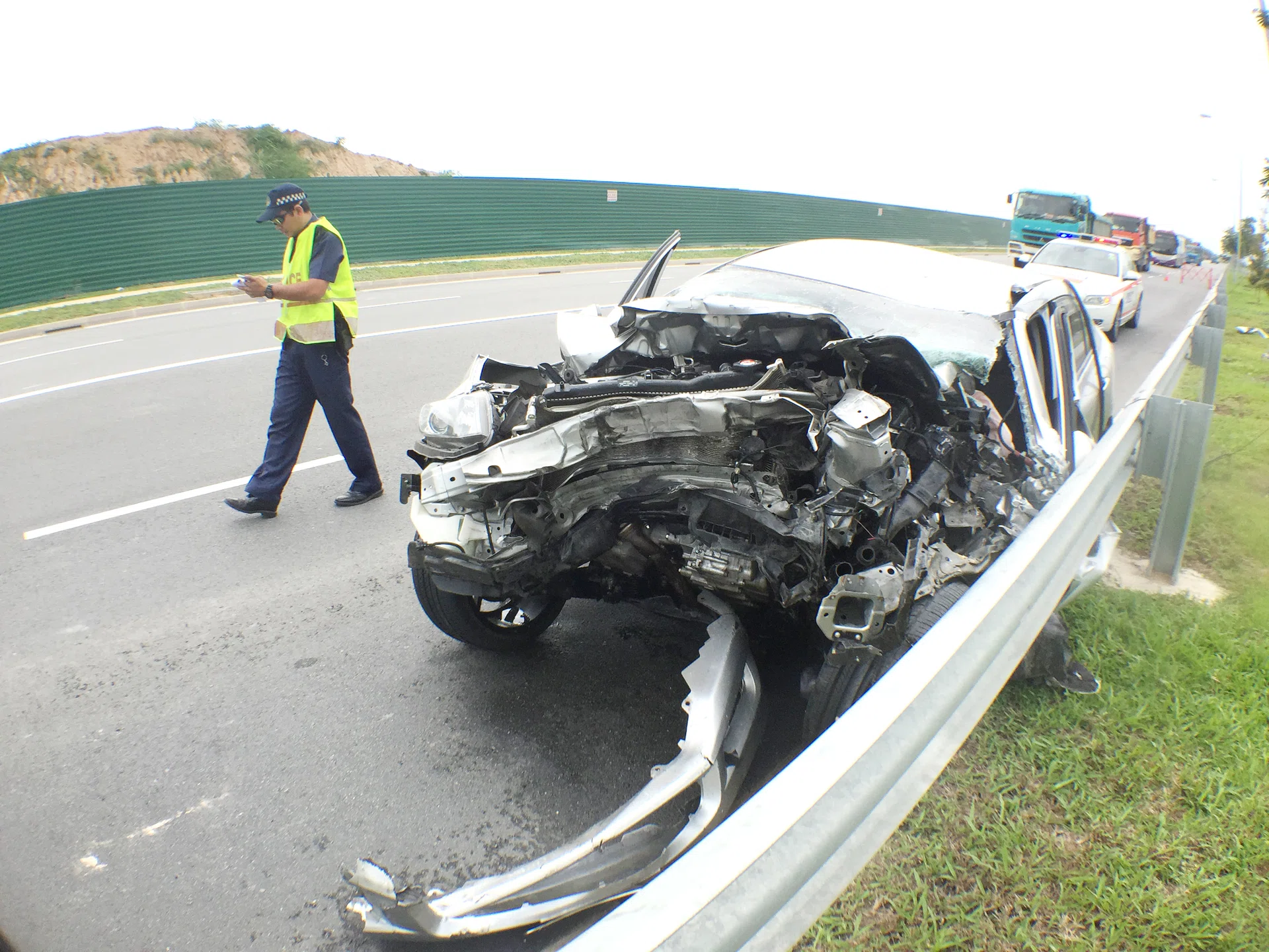 MANGLED: The damaged front part of the car after the accident along Changi Coast Road. 