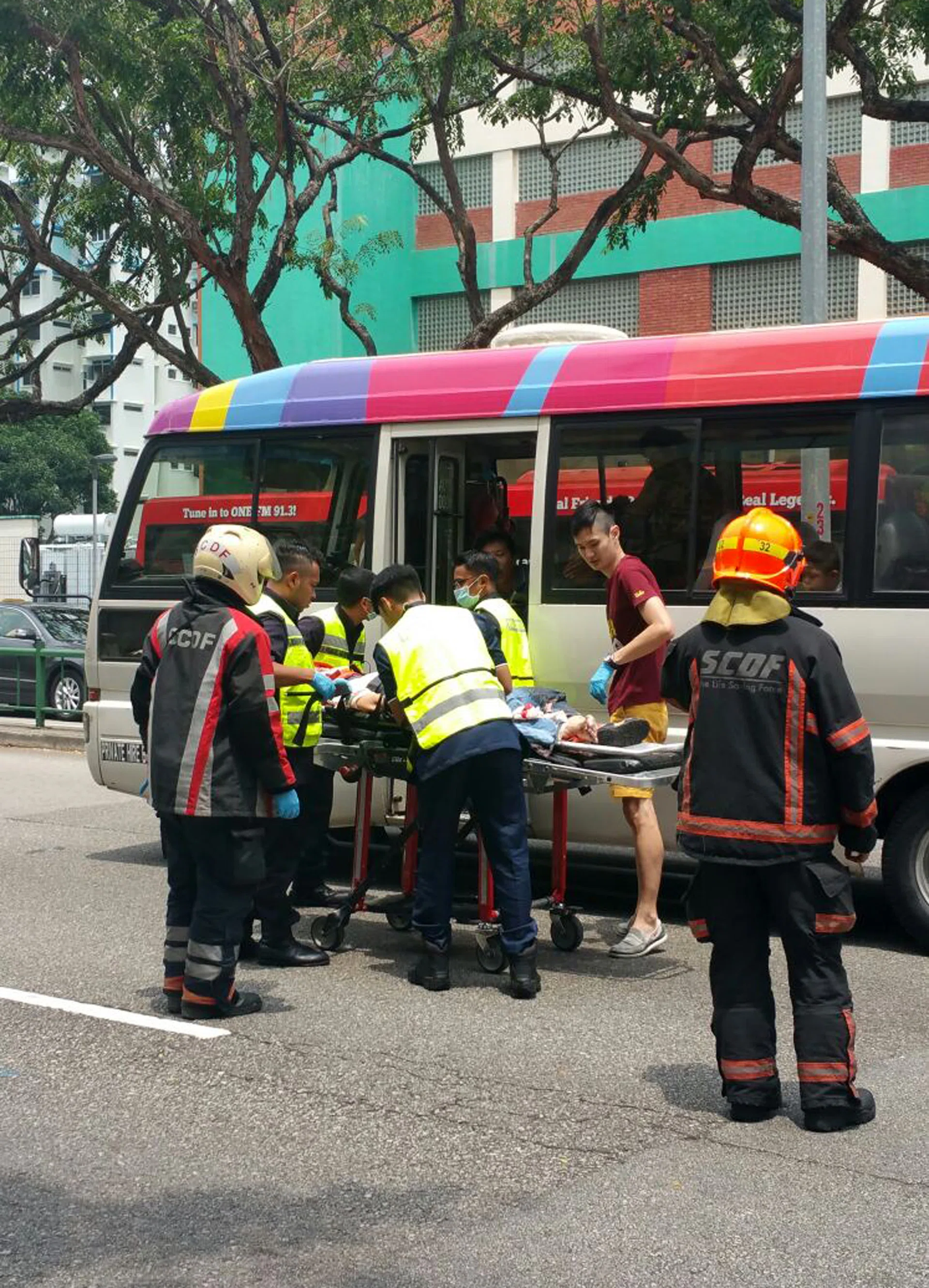 BADLY HURT: Paramedics attending to Ms Yong Soh Mui at the scene of the accident at Lorong 1 Toa Payoh. 
