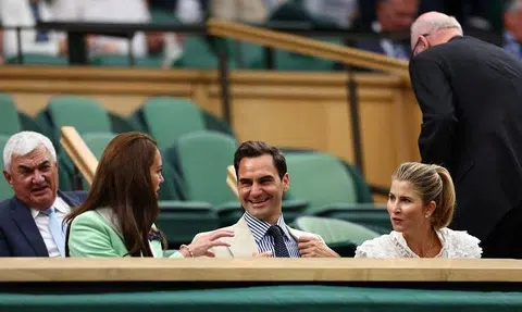 Without racket but still the king, Roger Federer wows Wimbledon crowd from royal box
