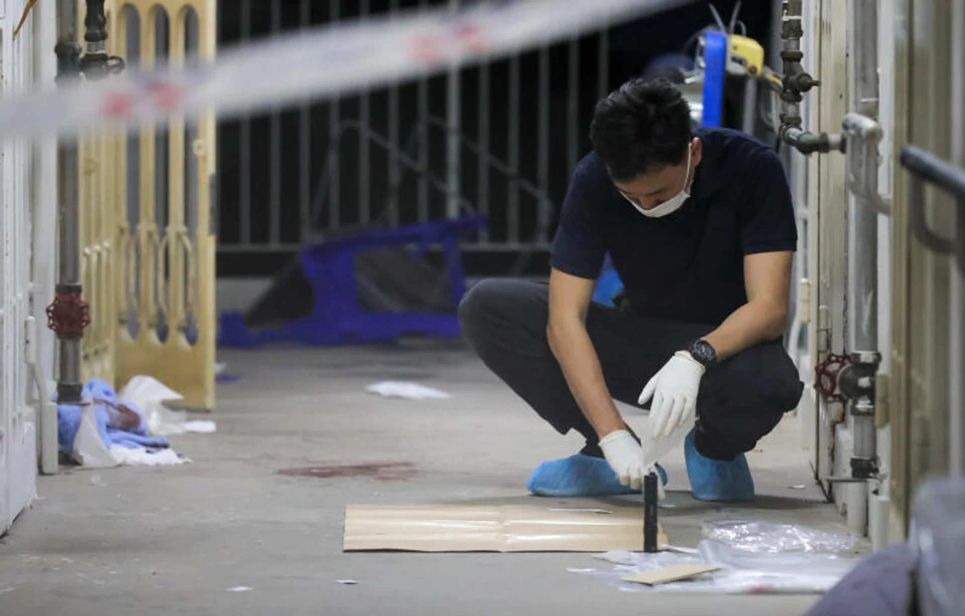 Investigators at the scene where a man was shot after advancing on police officers, in Bendemeer, on March 23, 2022. 