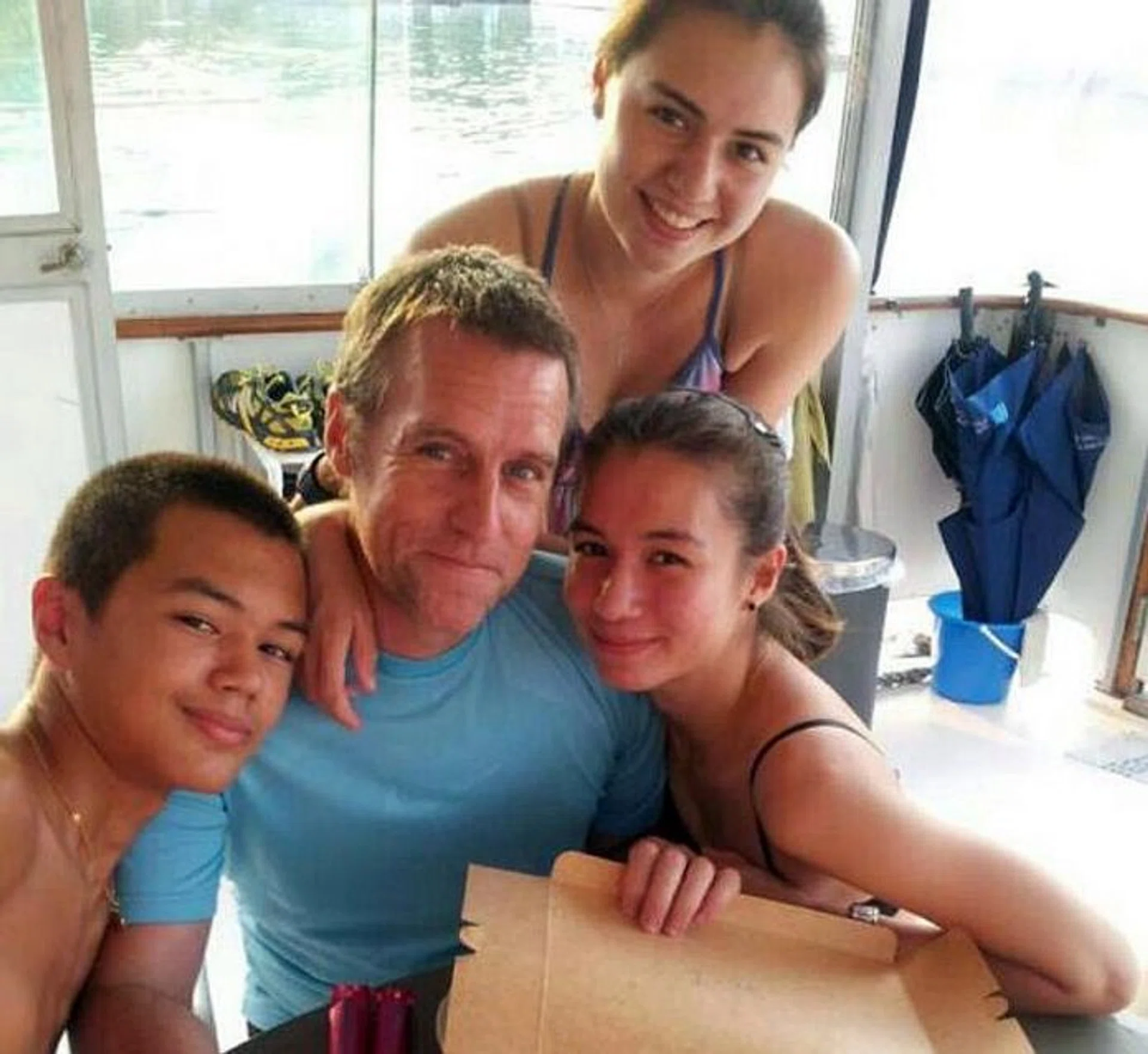 GOOD DEED: Mr Alan Bickham with his three children, Ryan, Alison and Melanie.