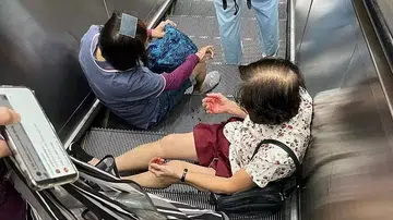 Man falls down MRT station escalator, lands on 2 commuters