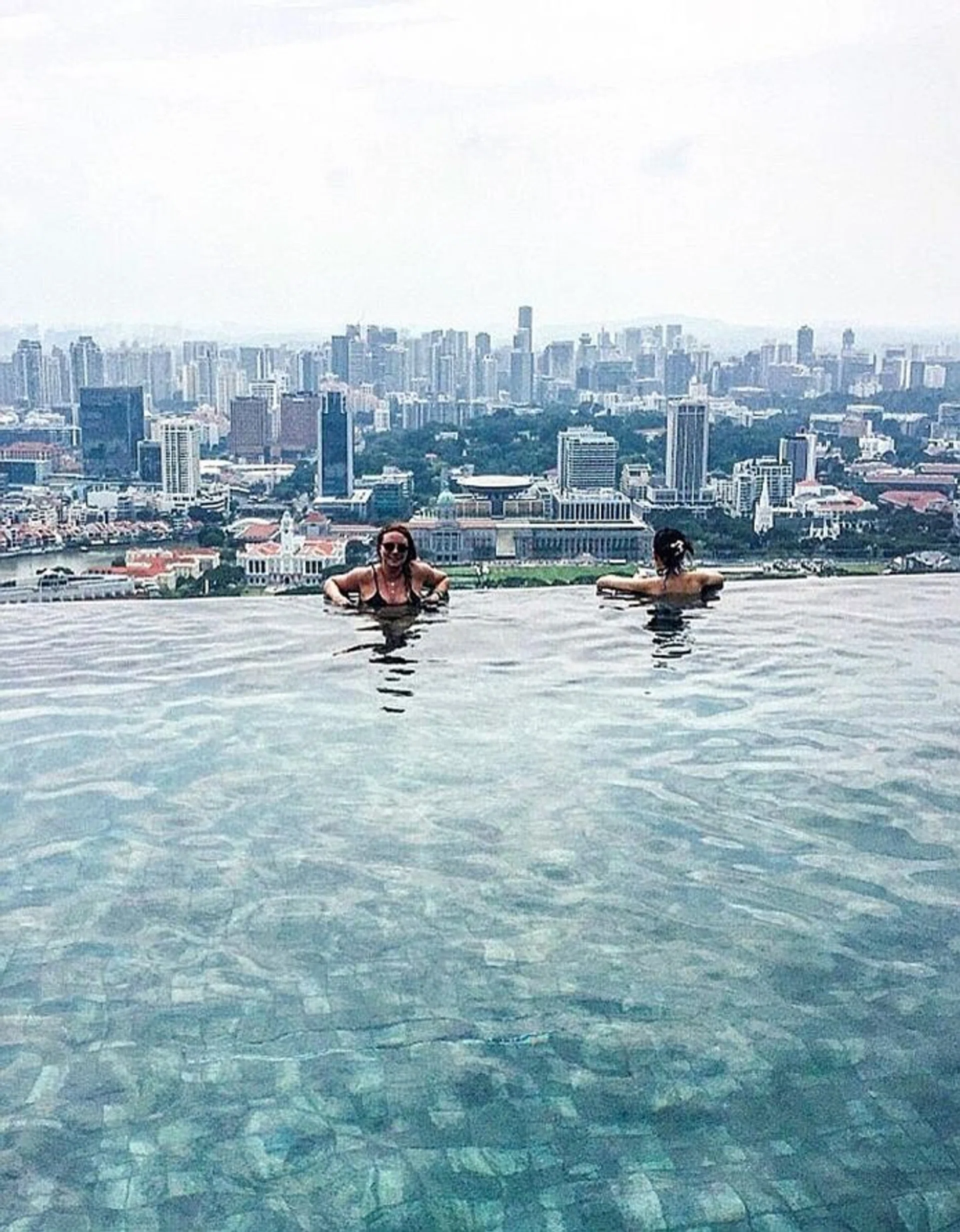 TACTIC: Tourist Emma Balmforth took bathrobes and slippers from a housekeeping cart to pass off as a hotel guest at Marina Bay Sands.
